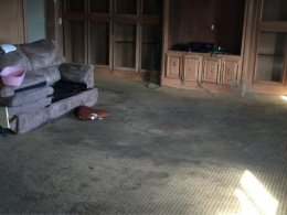 This photo, taken by West, shows some of the extensive damage done to the carpet throughout the property.